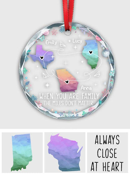 The Love Between Family Knows No Distance 
- Personalized Family Round Shaped Glass Ornament